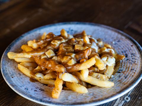 Poutine: fries topped with cheese curds and beef gravy