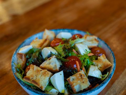 Panzanella salad: mixed greens, toasted ciabatta, tomatoes and bocconcini